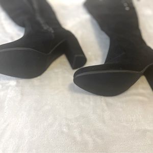 Black, size 8, tall suede black heel boots with laces on top.